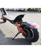 Oppheng for elektriske kjøretøy, scootere, sykler, etc.